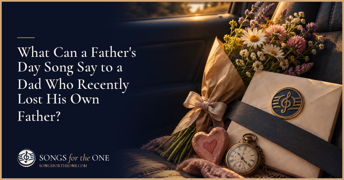 A father and his child sitting together on a porch with a small Father's Day gift and an older family photograph nearby.