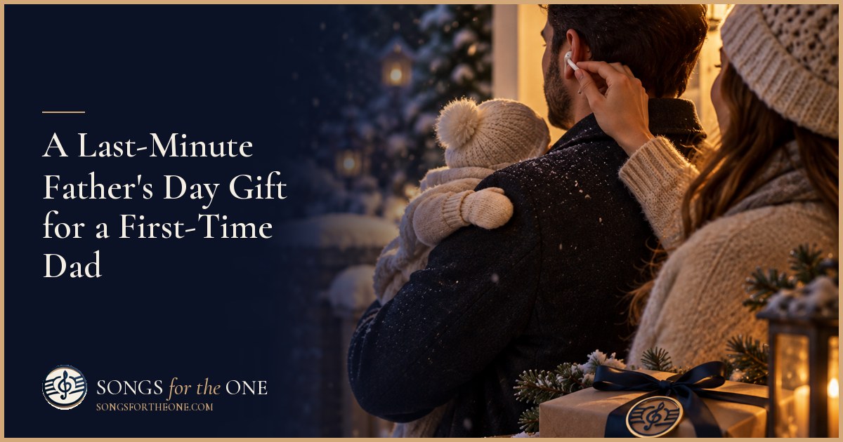 First-time dad holding his baby on a sofa while his partner offers headphones beside a small Father's Day breakfast tray.