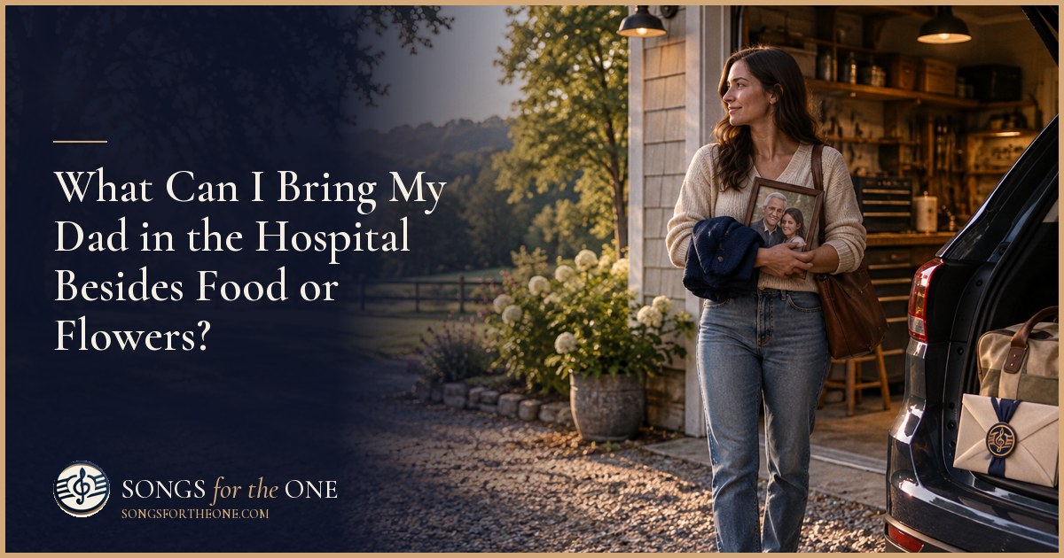 Adult child offering their father a small family photo beside a hospital bed, with a paperback and headphone case nearby.